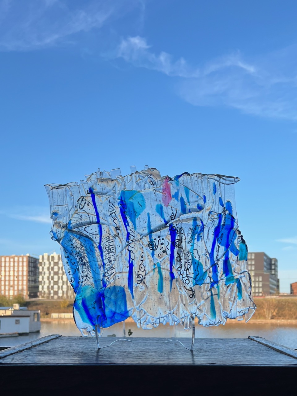 Fused glass panel with layered colors and textures