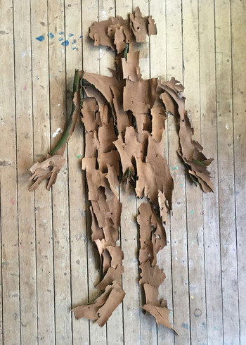 Full figure self-portrait assembled from moss and plane tree bark